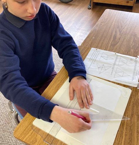 child using a protractor