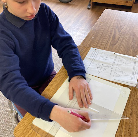 child using a protractor